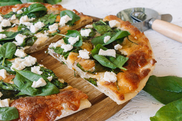 Pizza with spinach on a white background. Diet Pizza. Proper nutrition