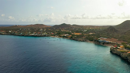 Aerial view of coast of Curacao in the Caribbean Sea with turquoise water, cliff, beach and...