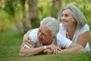Portrait of beautiful senior couple on grass