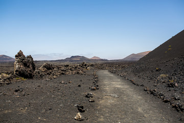 Fototapeta na wymiar Lava fields and desert landscape in Lanzarote