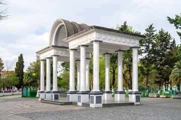 An entrance white arch to the city park of Poti, Georgia