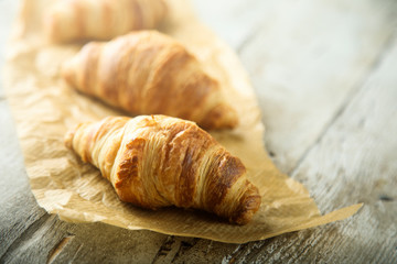 Homemade croissants on a wooden desk