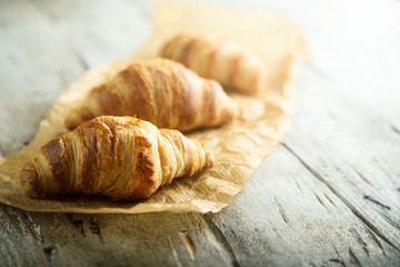 Homemade croissants on a wooden desk