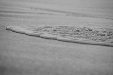 Wave On Sandy Beach. Background. Splash of waves on the sandy beach. foam, surf, waves.