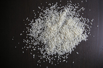 Raw white rice on wooden background
