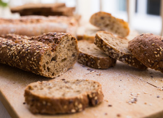 fresh loaf of bread on wooden board