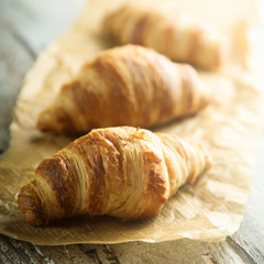 Homemade croissants on a wooden desk