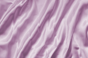 Closeup of rippled pink silk fabric lines