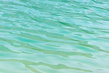 Turquoise rippled surface of a lake.