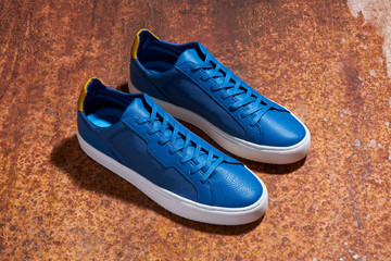 Casual shoe on rusty background