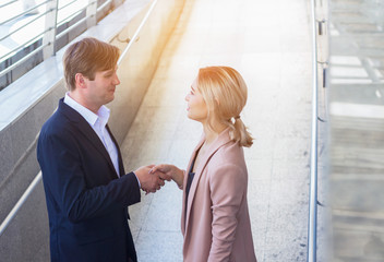 Fototapeta premium Business men and business women shake hands in greeting