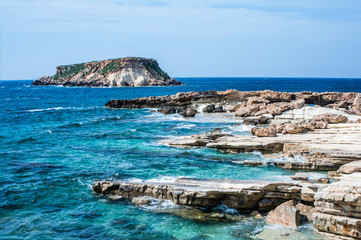 Cape Drepano on the west coast of Cyprus is an amazing natural phenomenon. Sea waves expose a white layered rock that takes on bizarre shapes.   