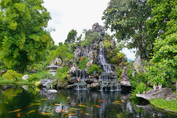 Fototapeta na wymiar Garden with waterfalls and a pond in the Pagoda of the Celestial Lady. Hue, Vietnam