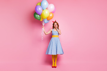 Full body photo of crazy excited lady have summer anniversary event hold many baloons impressed gift scream wow omg wear yellow blue pantyhose isolated over pink color background