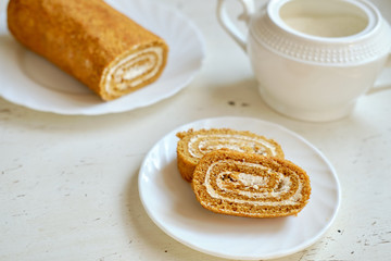 slice of honey roll on a white table