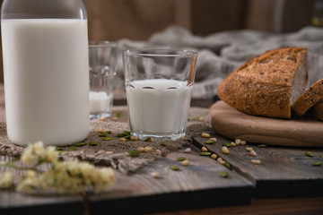 Rustic breakfast with milk and bread on Milk Day, first of June. Horizontal shot.