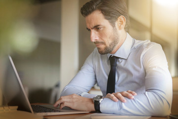 boss in home confinement working on his laptop