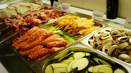 New coronavirus, Covid-19, no people in cafeteria with delicious snacks, meat, sausages and vegetables