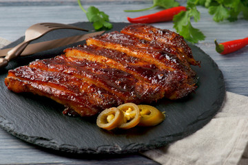 grilled pork ribs on a wooden background