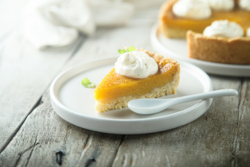 Homemade pumpkin pie with whipped cream