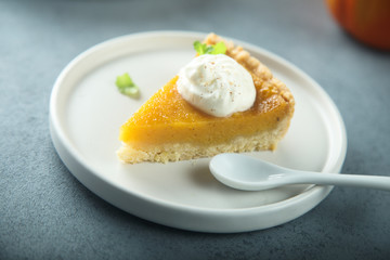 Homemade pumpkin pie with whipped cream