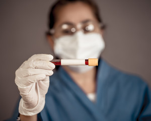 Scientist testing coronavirus positive blood sample researching for COVID-19 antibodies and vaccine