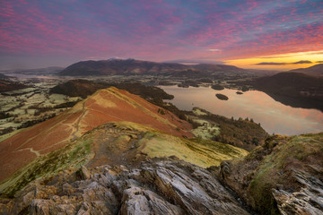 Vibrant Mountain Sunrise Taken From High Up Catbells Summit Looking Over Calm Derwentwater Lake. Lake District National Park, UK.