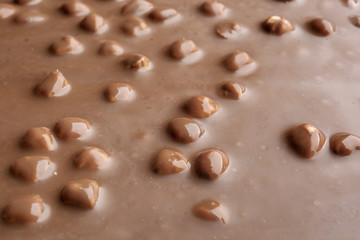 Sweet chocolate with nuts as background