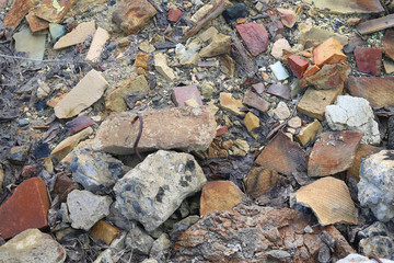 Construction waste with elements of and destroyed old structures at municipal landfill