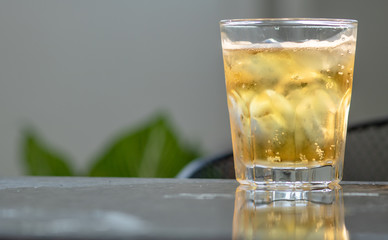 Glass beer on gray background with copy space. and space for text on the right. stay at home.