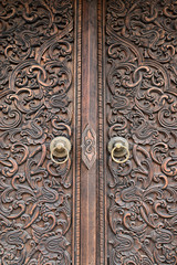 Features of carved wooden doors and metal doorrings in Chinese classical architecture