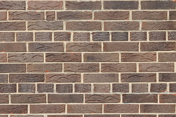 Obraz premium Brown background of beautiful unusual building brick