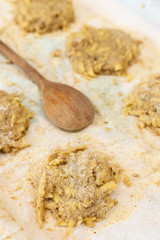 Preparing Raw grated potatoes with breadcrumbs