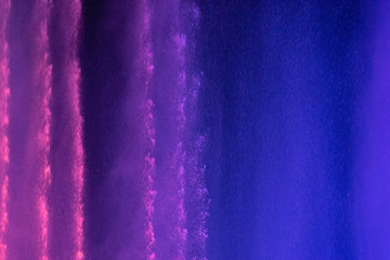 Neon background of light and water splashes