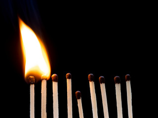 Social Distancing concept using burn match sticks as a metaphor for containing corona virus outbreak
