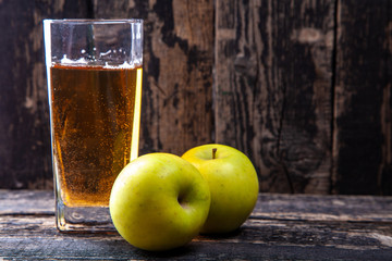 glass of apple juice and apples