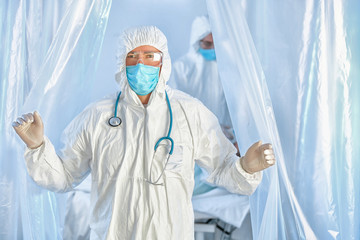 Doctor in biohazard suit in contagious isolation ward. Concept of Coronavirus epidemic