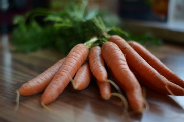 orange carrots on a table in the kitchen