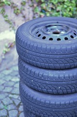 Stack of black tyres during tyre change