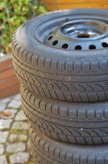 stack of car tires in the backyard