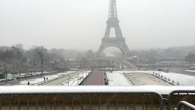 Eiffel Tower in winter with snow in Paris France, seen from the Place du Trocadero, on a snowy day