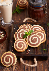 Two colored delicious homemade cookies with vanilla and chocolate flavor in a shape of spiral.  