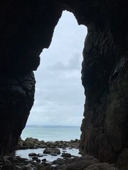 looking out from a cave onto the sea