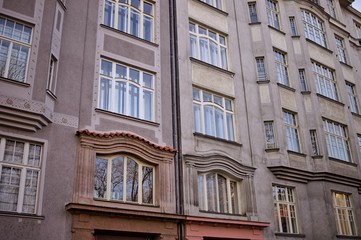 Fototapeta na wymiar Vintage facade of a building with a lot of windows (Prague, Czech Republic, Europe)