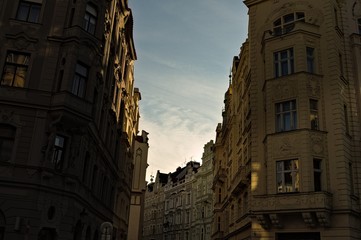Sunset seen from a street in Prague through the buildings (Czech Republic, Europe)