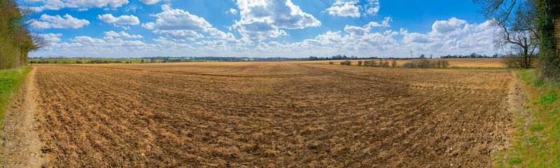 Fototapeta na wymiar ploughed fields panoramic low level view