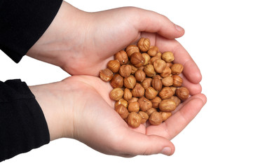Hazelnuts in hand on white background