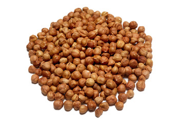 Pile of hazelnuts isolated on white background
