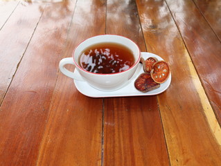 Bael Fruit Juice, health drink Place on a wooden table.