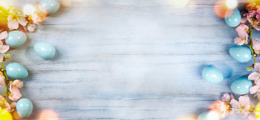 Easter background with Easter eggs and spring flowers